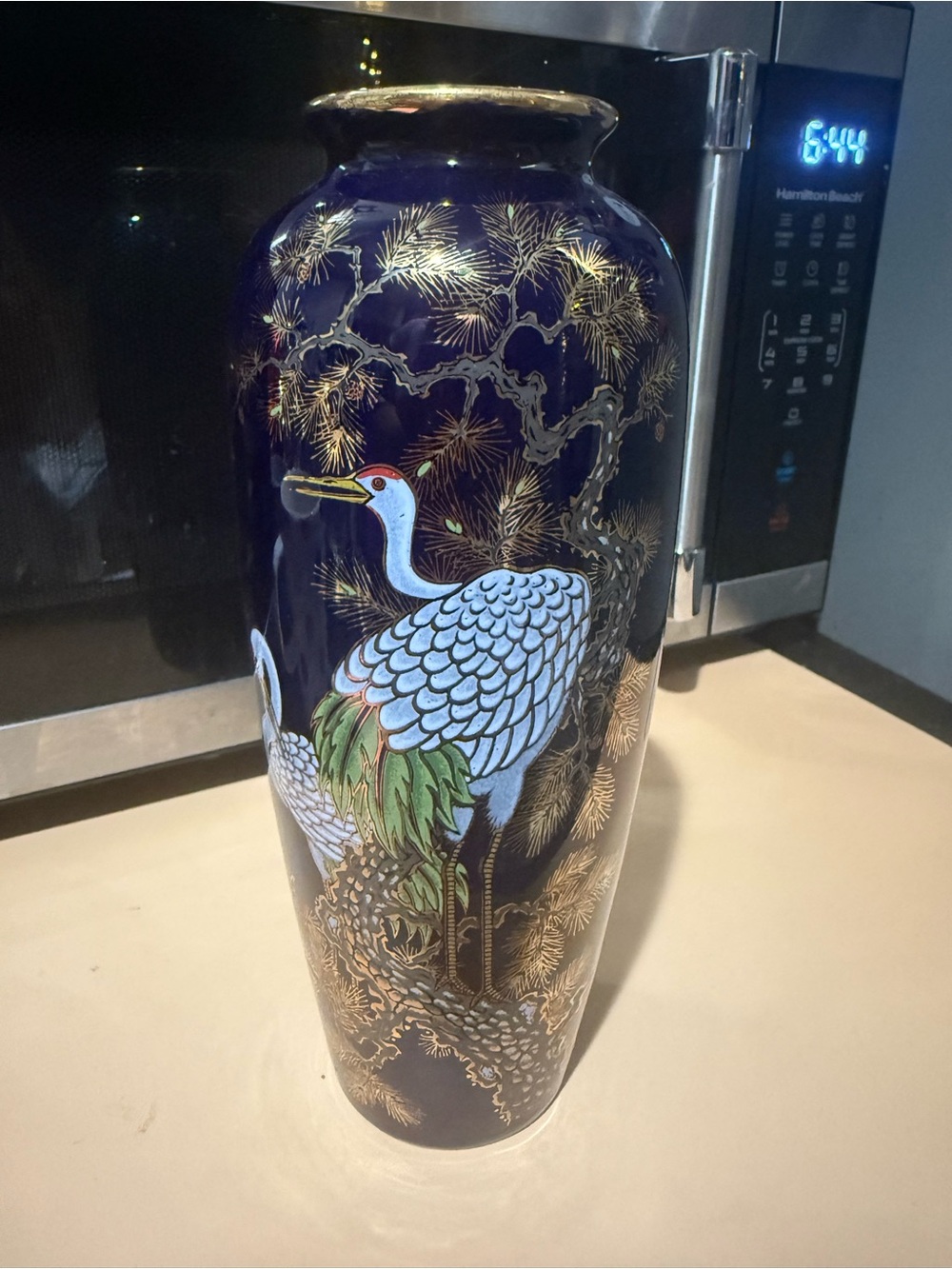 Vintage Japanese cobalt blue porcelain vase featuring a hand-painted crane.